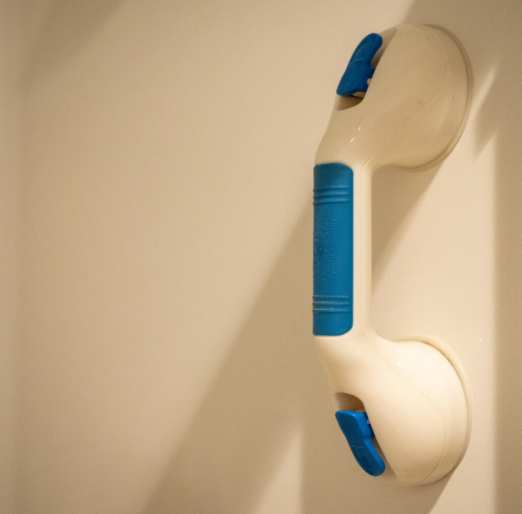 A grip attaches to a shower wall at Betty Tribe&rsquo;s home in Ridgefield, as seen July 30. (Taylor Balkom/The Columbian)
