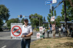 Skamania County resident Karl Manheim, left, greets motorists during a Friday protest in Washougal. J.L. Storedahl &amp; Sons submitted an application to open a gravel mine north of Washougal, raising concerns about traffic and impacts to the Columbia River Gorge. Below, opponents of the proposed mine distribute informational handouts in downtown Washougal on Friday. (Photos by Amanda Cowan/The Columbian)