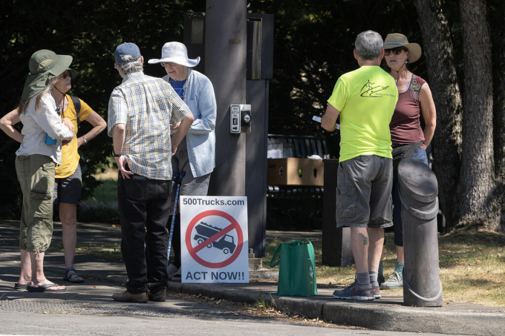 Residents gather in downtown Washougal on Friday to voice concerns about a proposed mine 10 miles north of the city. J.L. Storedahl & Sons filed an application for a conditional use permit for the gravel mine, raising concerns about impacts to the Columbia River Gorge.