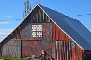This barn quilt at Bi-Zi Farms is easy to see from the road. There is another, smaller barn quilt on the side of the farm store. (Photos contributed by Julie Byler)