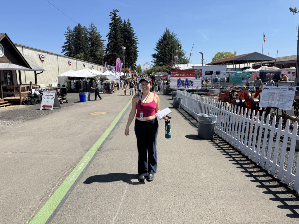 Reporter Kimberly Cortez replicates the Christian family&rsquo;s annual fair photo during her first visit to the Clark County Fair. (Kimberly Cortez/The Columbian)