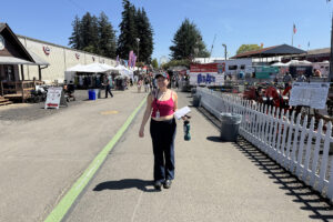 Reporter Kimberly Cortez replicates the Christian family&rsquo;s annual fair photo during her first visit to the Clark County Fair. (Kimberly Cortez/The Columbian)