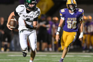 Woodland quarterback Michael Belvin, left, who also plays linebacker, will be one of several key pieces for the Beavers this season. (Taylor Balkom/The Columbian)
