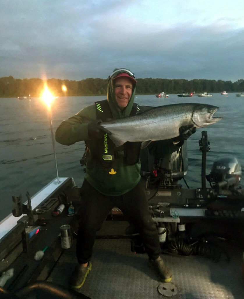 Fishing Guide Dave Mallahan proudly displays a fall Chinook taken in the lower Columbia River. Mallahan will follow the schools of Chinook up the Columbia River through the coming month. (Photo courtesy of David Mallahan)