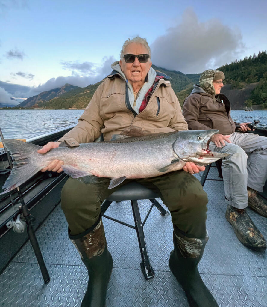 A guest of guide Dave Mallahan holds a nice Chinook salmon he took in Drano Lake last year. Hover fishing is the go-to method at Drano. (Photo courtesy of David Mallahan)