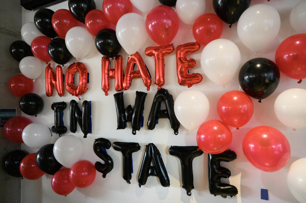 Balloons festoon a wall Aug. 14 during a No Hate in WA State rally at Fourth Plain Community Commons in Vancouver. (Taylor Balkom/The Columbian)