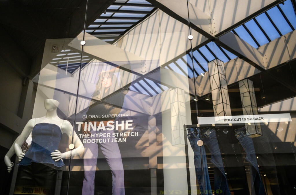 Skylights are reflected in the storefront of Express on Aug.25 at Vancouver Mall.