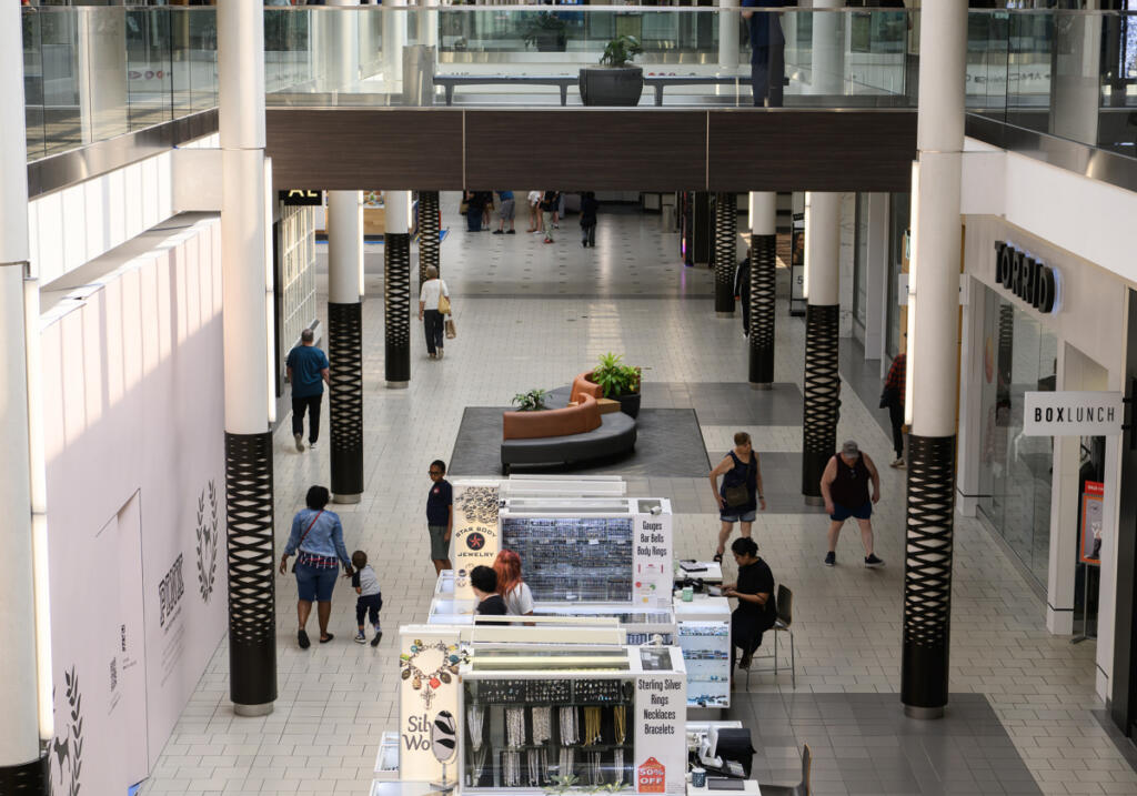 Shoppers walk Tuesday through the lower level of Vancouver Mall.