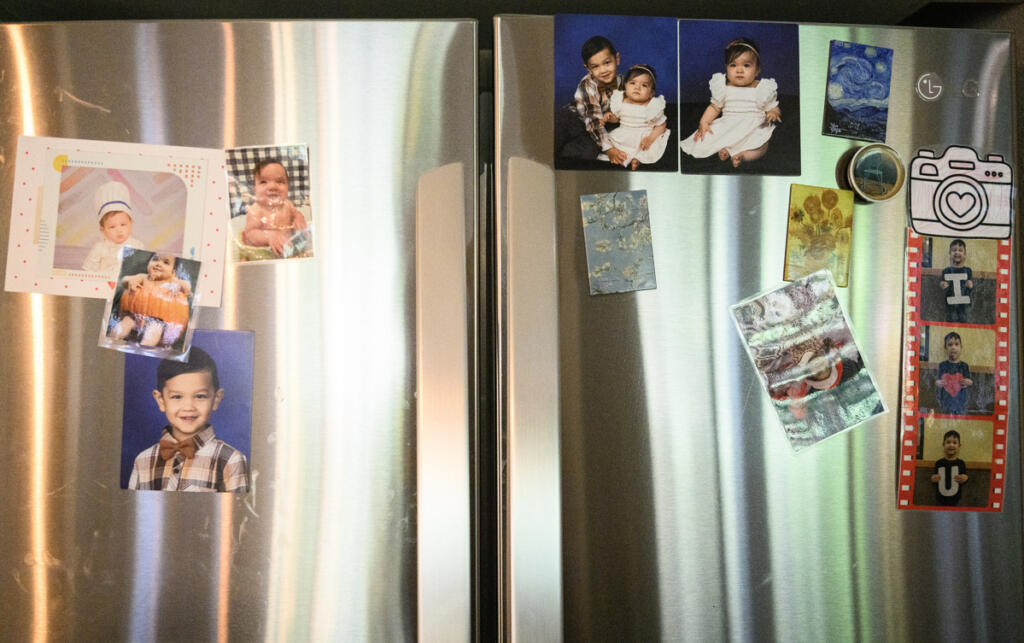 Photos of Theodore and Ella Wiener hang on a fridge Aug. 25 at the Wiener residence in Camas.