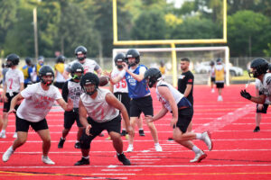 Camas players run through a play during a football practice at Camas High School&rsquo;s Cardon Field. Camas will host Chiawana in its opener. (Tim Martinez/The Columbian)