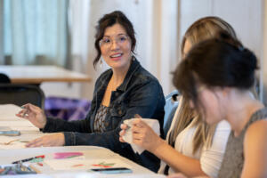 Camas artist Jilleen Shahidi, left, chats with participants Sept. 1 during Memory Garden, a monthly art meetup for adults at Camas Community Center. (Amanda Cowan/The Columbian)
