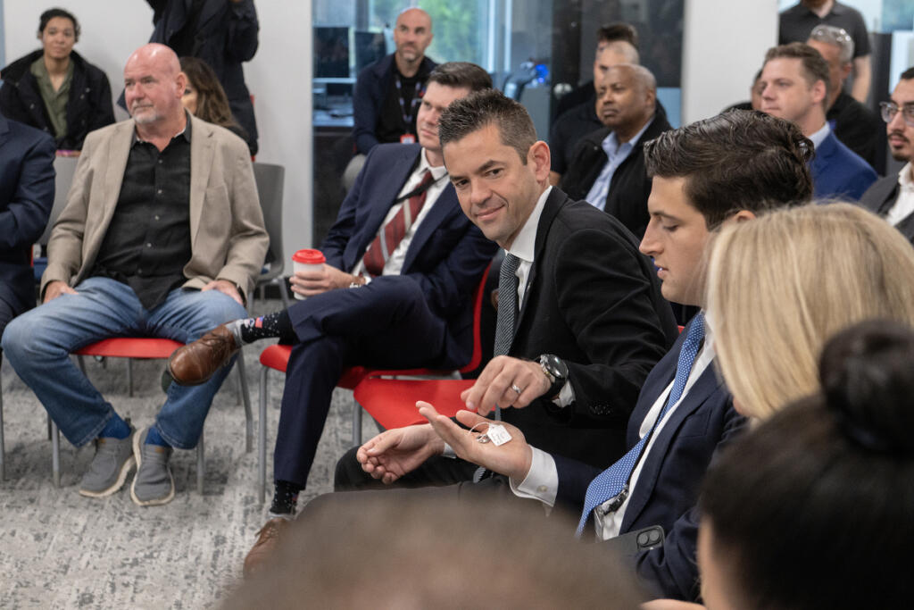 NASA Administrator Jared Isaacman, center, looks over parts for a spaceship with fellow representatives from NASA and members of United Precision Corp., a Washougal-based aerospace manufacturer, on Thursday morning.