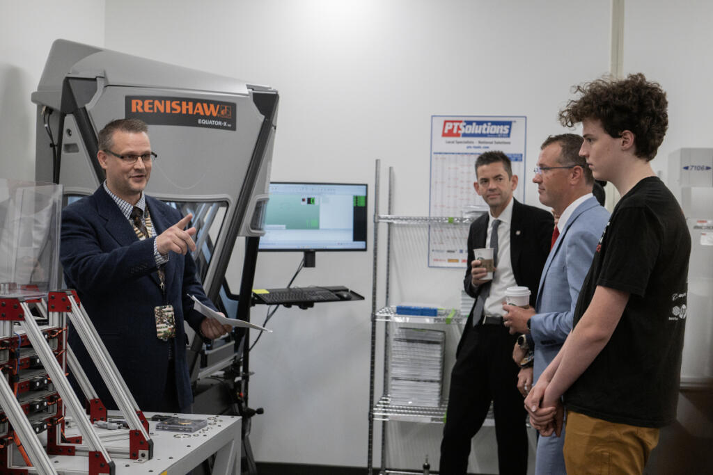 Quality manager Stephen Kerr, left, speaks with NASA Administrator Jared Isaacman, second from left, and others during a tour of United Precision Corp., a Washougal-based aerospace manufacturer, on Sept. 3. (Amanda Cowan/The Columbian)