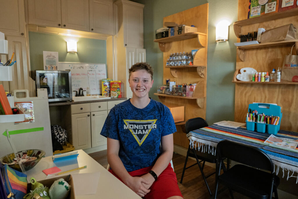 Niko Blank, a Camas High School senior, takes a break at LiveWell Camas&rsquo; Third Space on Wednesday afternoon. The area will give local young people a place to gather and connect outside of home or school. (Amanda Cowan/The Columbian)