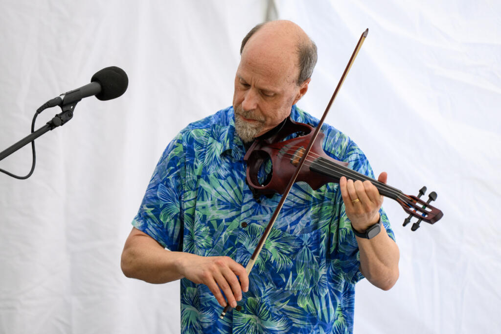 Seth Moran plays a fiddle Sept. 4 during First Friday in downtown Camas. (Taylor Balkom/The Columbian)