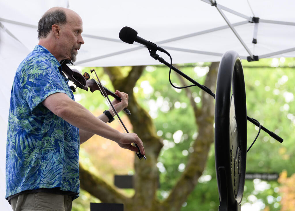 Seth Moran plays a fiddle Sept. 4 during First Friday in downtown Camas. (Taylor Balkom/The Columbian)