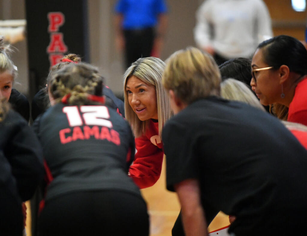 Camas volleyball coach Michelle Ford gives instructions to her players before a non-league volleyball match against Curtis on Monday. It was Ford&rsquo;s idea to try and get a volleyball match played outdoors. (Tim Martinez/The Columbian)