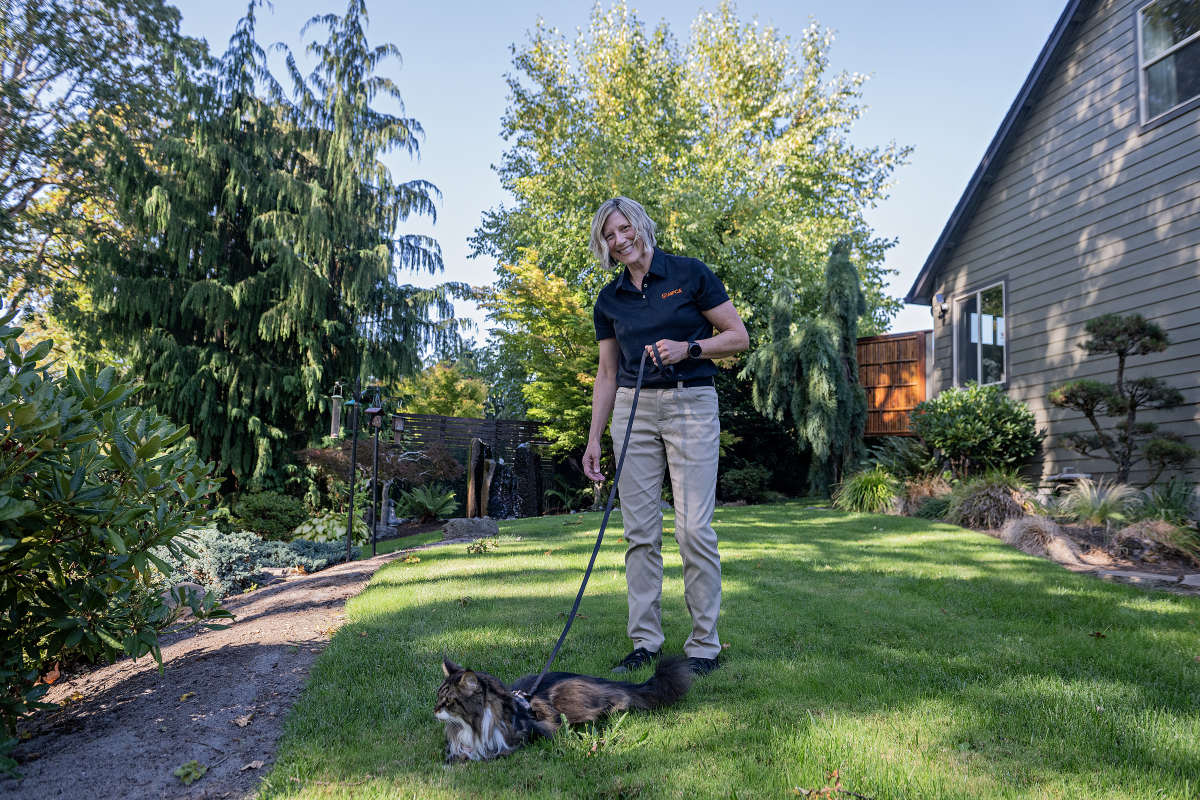 Susan Anderson, senior director of disaster response for the American Society for the Prevention of Cruelty to Animals, relaxes at her Vancouver home with her kitty, Bronto, 10, on Sept. 16. Anderson has deployed to countless natural disasters to help reunite displaced pets with their families and support animals left behind or in need of relocation. (Amanda Cowan/The Columbian)