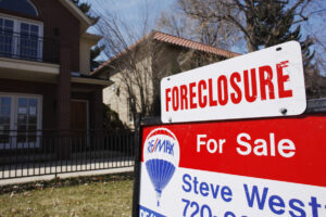 In this April 4, 2010, file photo, a foreclosure sign tops the for sale sign outside a home. Clark County&rsquo;s foreclosure rates increased more than 45 percent between 2024 and 2025. (AP Photo/David Zalubowski, File)