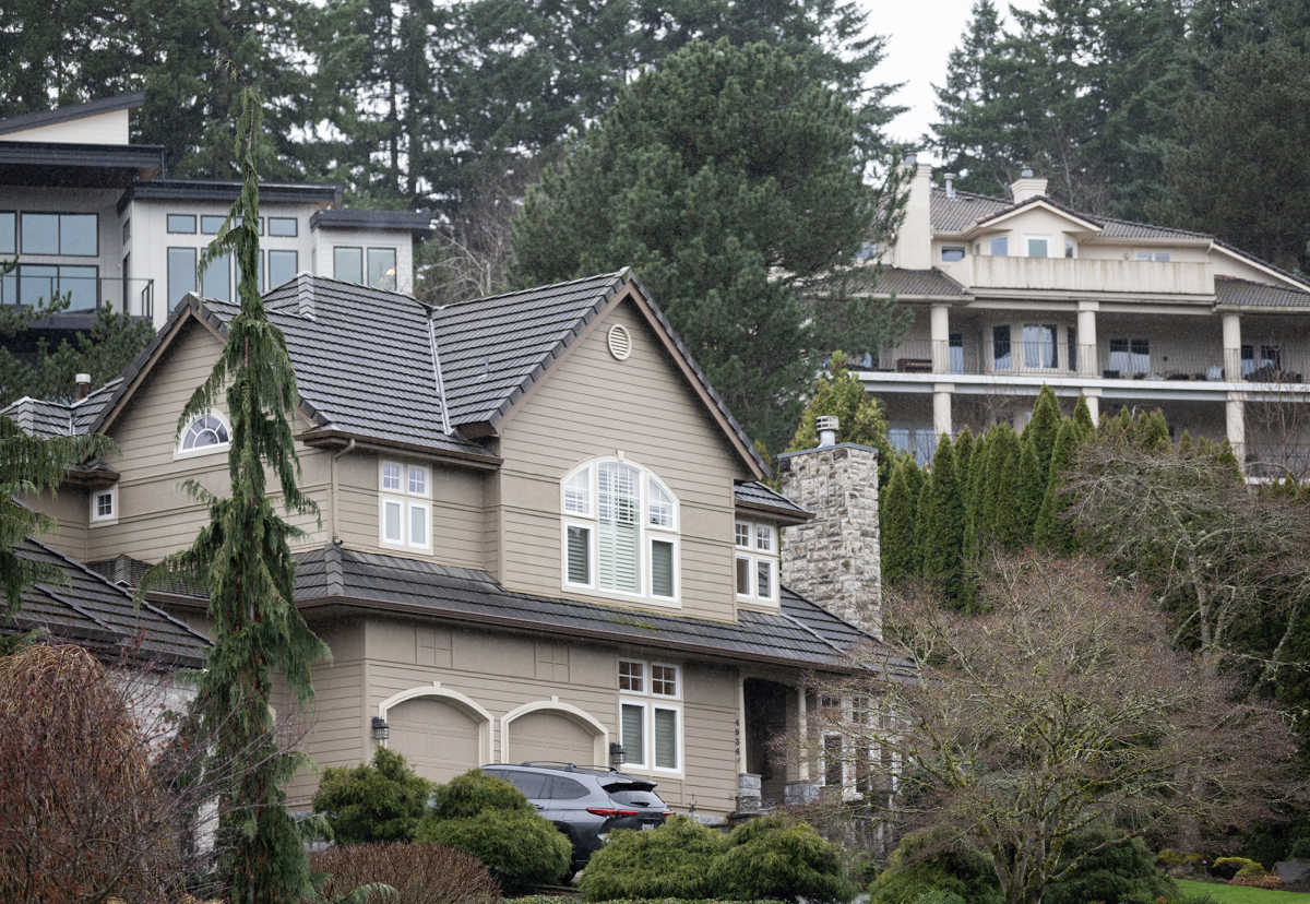 Expensive homes dot a hillside near Camas Meadows Golf Club on Feb. 18 along Lacamas Lake in Camas. More high-income earners have moved out of the county than into it since the COVID-19 pandemic. (Taylor Balkom/The Columbian files)