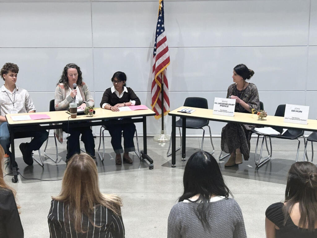U.S. Rep. Marie Gluesenkamp Perez, D-Skamania, right, attends a candidate forum at Discovery High School in Camas on Oct. 5. (Kelly Moyer/The Columbian)