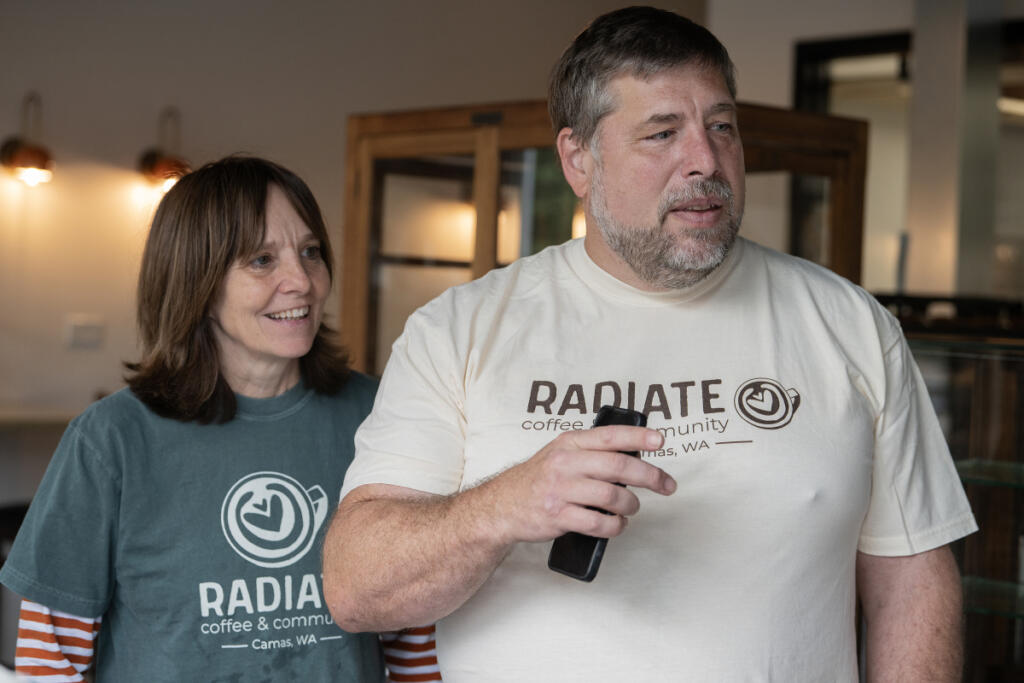 Kelly and David Wigen chat with employees at Radiate Coffee and Community in Camas on Wednesday morning. The coffee shop, which opened in September, provides inclusive employment for people with disabilities. (Amanda Cowan/The Columbian)