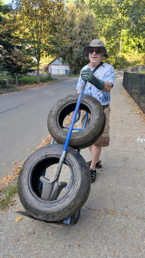Lacamas Watershed Council President Ty Cobb removes tires from Round Lake in Camas on Sept. 29. (Contributed by Ty Cobb)