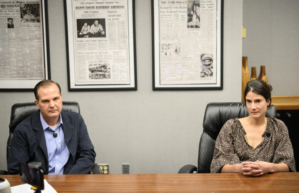 Republican challenger John Braun, left, and U.S. Rep. Marie Gluesenkamp Perez, D-Skamania, listen to a question during The Columbian&rsquo;s Oct. 5 editorial board interview of the 3rd District candidates at the newspaper&rsquo;s Vancouver offices. (Taylor Balkom/The Columbian)