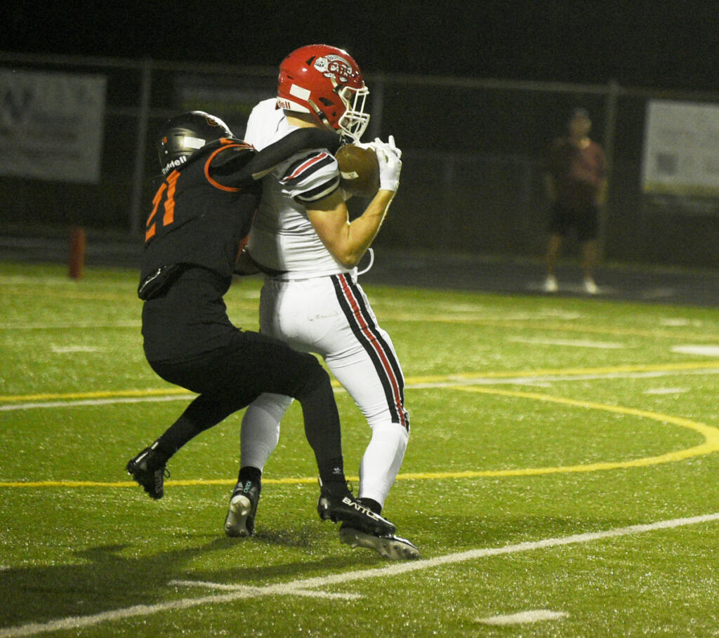 Camas receiver Luke Parbon, right, hauls in a catch while Brandon Kelo of Battle Ground defends during a Class 4A Greater St. Helens League football game on Friday, Oct. 2, 2026 at District Stadium in Battle Ground. (Micah Rice/The Columbian)