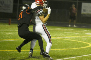 Camas receiver Luke Parbon, right, hauls in a catch while Brandon Kelo of Battle Ground defends during a Class 4A Greater St. Helens League football game on Friday, Oct. 2, 2026 at District Stadium in Battle Ground. (Micah Rice/The Columbian)