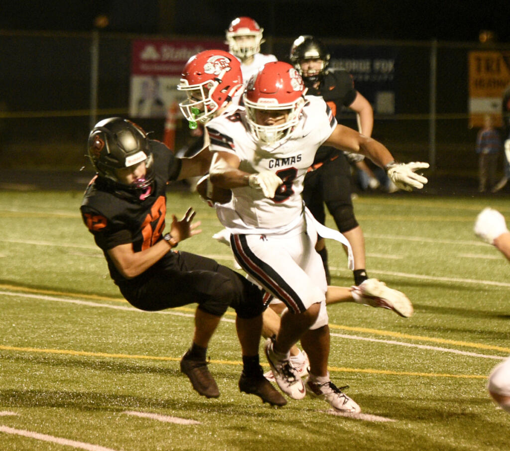 Thor Brody (8) of Camas throws a block during a carry by Kian Krueger during a Class 4A Greater St. Helens League football game against Battle Ground on Friday, Oct. 2, 2026 at District Stadium in Battle Ground.
(Micah Rice/The Columbian)