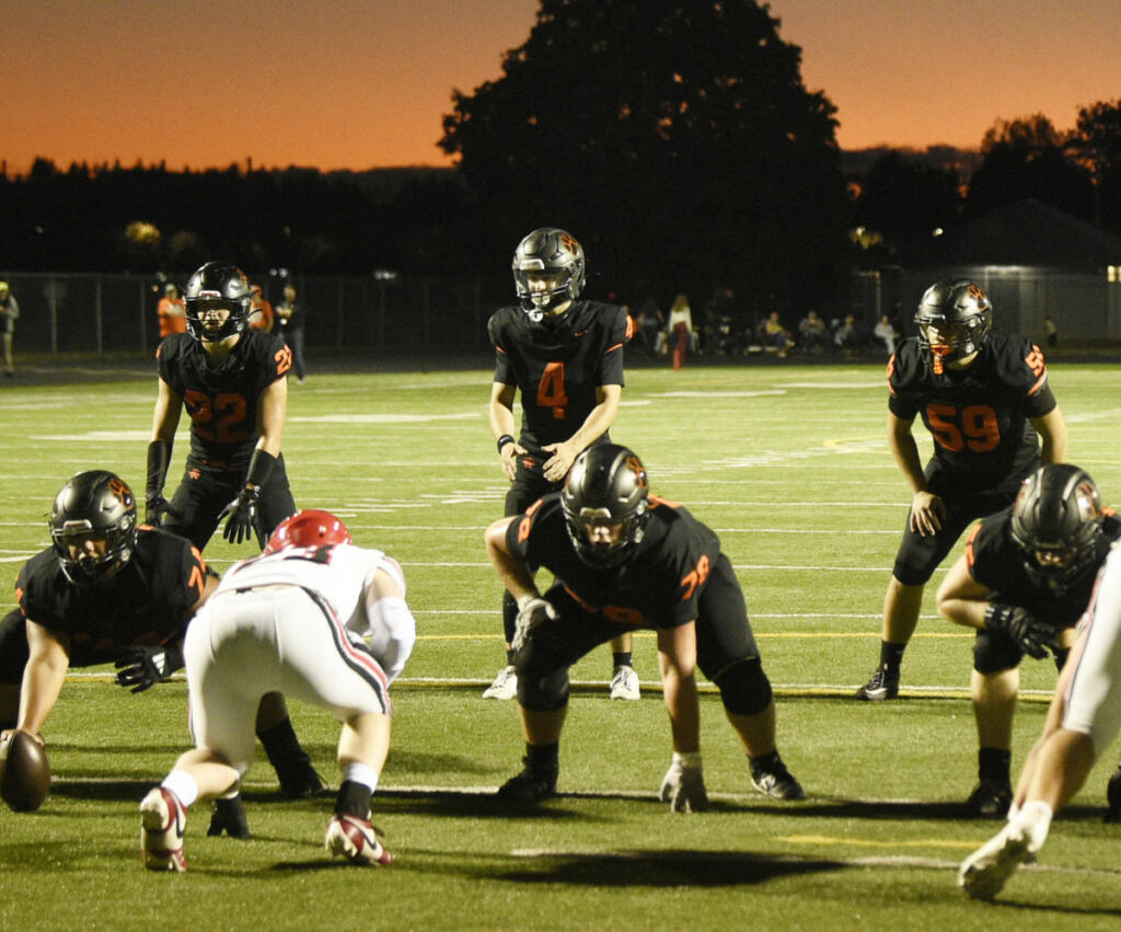 Battle Ground quarterback Jacob Bryant (4) waits for the snap during a Class 4A Greater St. Helens League football game against Camas on Friday, Oct. 2, 2026 at District Stadium in Battle Ground. (Micah Rice/The Columbian)