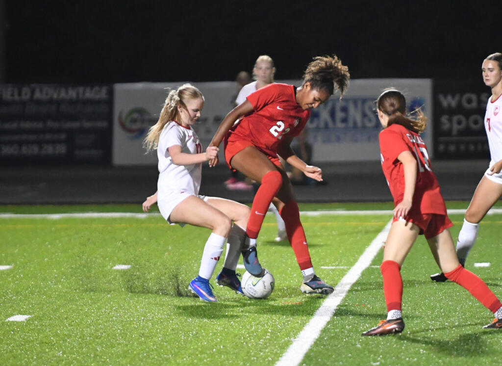 Camas junior Kaliyah Salley (22) challenges Union freshman Keira Moore, left, for the ball during a 4A Greater St. Helens League match Tuesday at Doc Harris Stadium in Camas. Salley scored two goals in the Papermakers&rsquo; 3-0 win. (Tim Martinez/The Columbian)