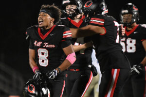 Camas senior Thor Brody (8) celebrates after the Papermakers kneeled out the clock to beat Kelso 34-30 on Friday. (Taylor Balkom/The Columbian)