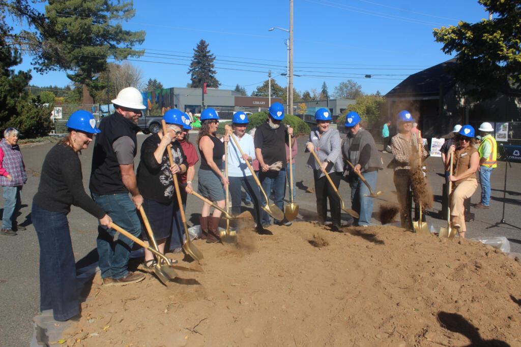 Key project participants shovel dirt during Thursday&rsquo;s groundbreaking ceremony for the new Washougal library. (Photos by Doug Flanagan/The Columbian)