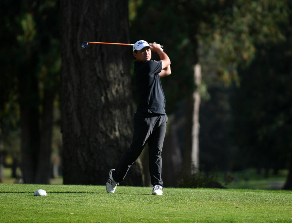 Ryker Jun of Camas hits a tee shot on the No. 18 hole at Lewis River Golf Club on Tuesday during the 4A Greater St. Helens League boys golf district tournament. He would win by one stroke. (Tim Martinez/The Columbian)