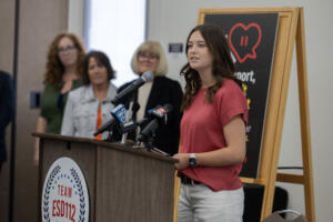 Prairie High School student Addi Juhnke, right, speaks during a press conference announcing the Report, Don&rsquo;t Repost initiative at Educational Service District 112 Conference Center on Tuesday morning. (Amanda Cowan/The Columbian)