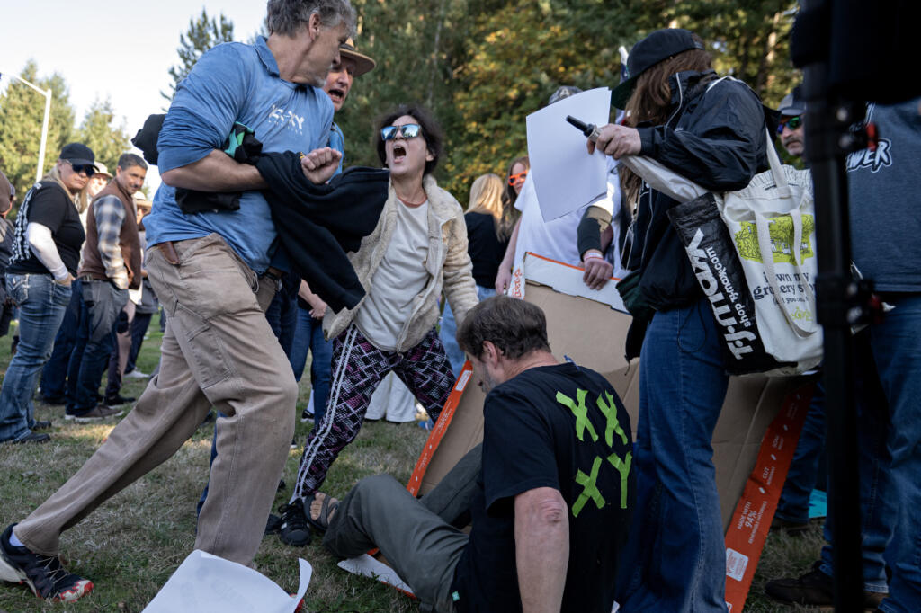 Demonstrators clash outside Wednesday&rsquo;s 4A Greater St. Helens League district cross country championship in Camas, where a transgender girl competed. (Amanda Cowan/The Columbian)