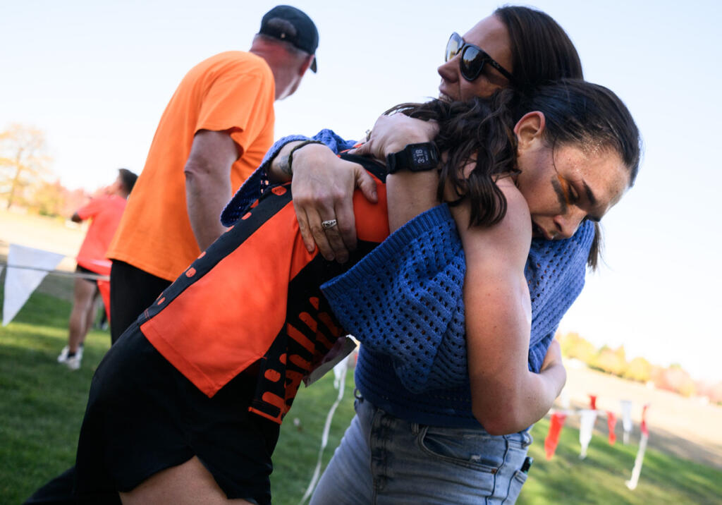 Battle Ground senior Sophia Rogers embraces her mom Kelly Rogers after Sophia won the girls race Wednesday, Oct. 1, 2026, during the 4A GSHL District Meet at UL Campus in Camas. (Taylor Balkom/The Columbian)