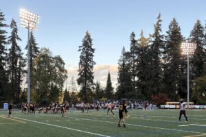 Washougal and Hudson&rsquo;s Bay play under the late-afternoon skies and lights of Kiggins Bowl on Oct. 23. (Meg Wochnick/The Columbian)